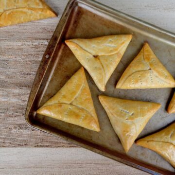 pine tarts baked golden brown on a baking tray