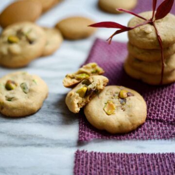 Pistachio cookies on a purple napkin