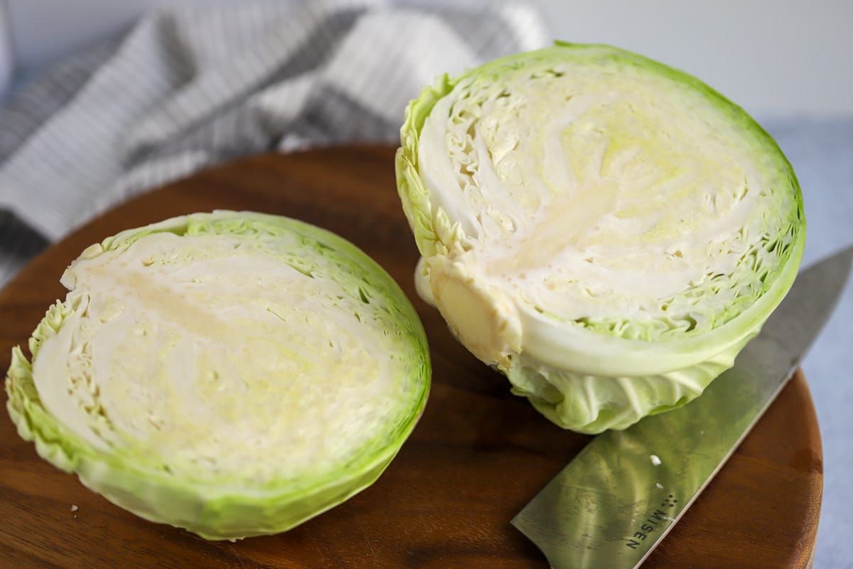 Whole head of cabbage chopped in half.