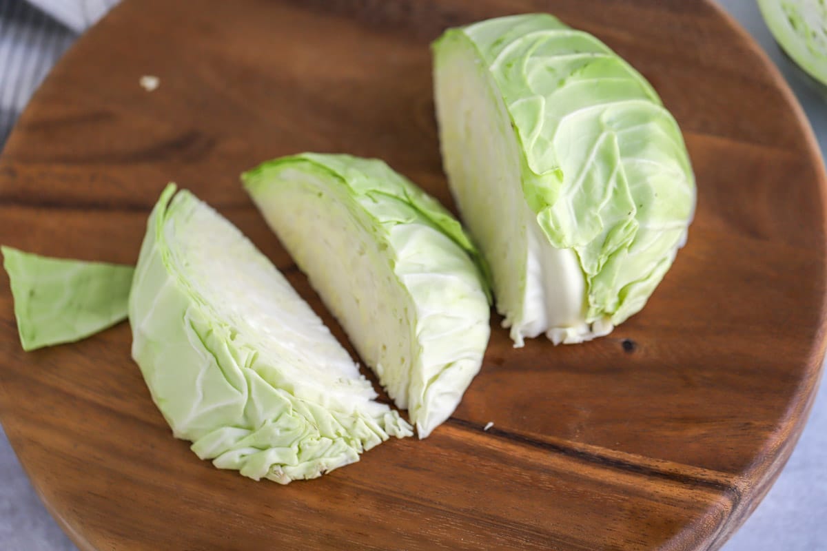 Whole head of cabbage chopped into wedges.