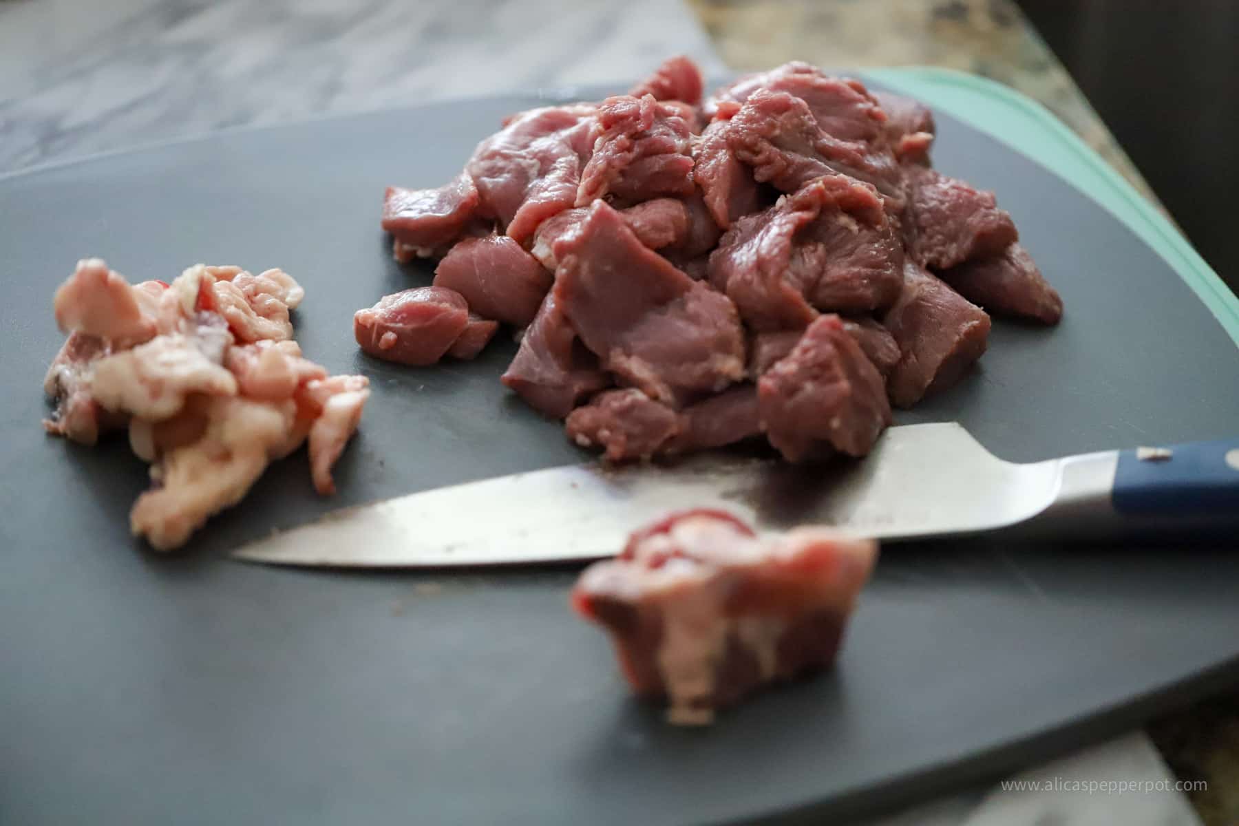 Lamb on cutting board with fat removed.