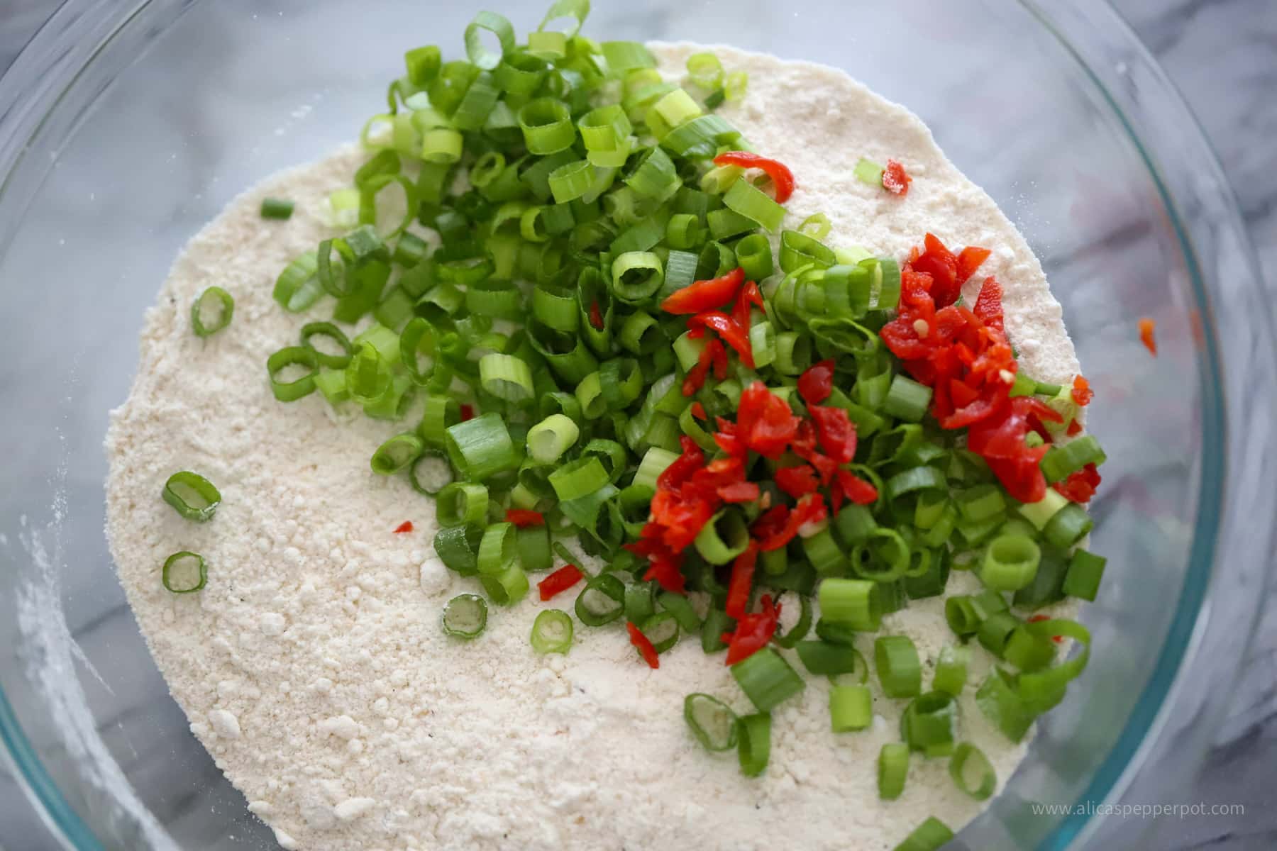 Scallion and wiri wiri pepper mixed in with the flour mixture