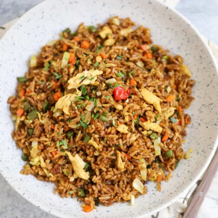 Small batch fried rice in serving dish with fork on side of plate.