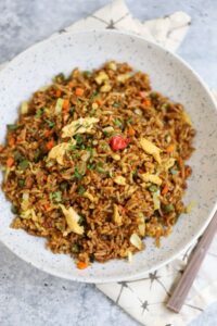 Image of small batch fried rice in speckled serving dish.