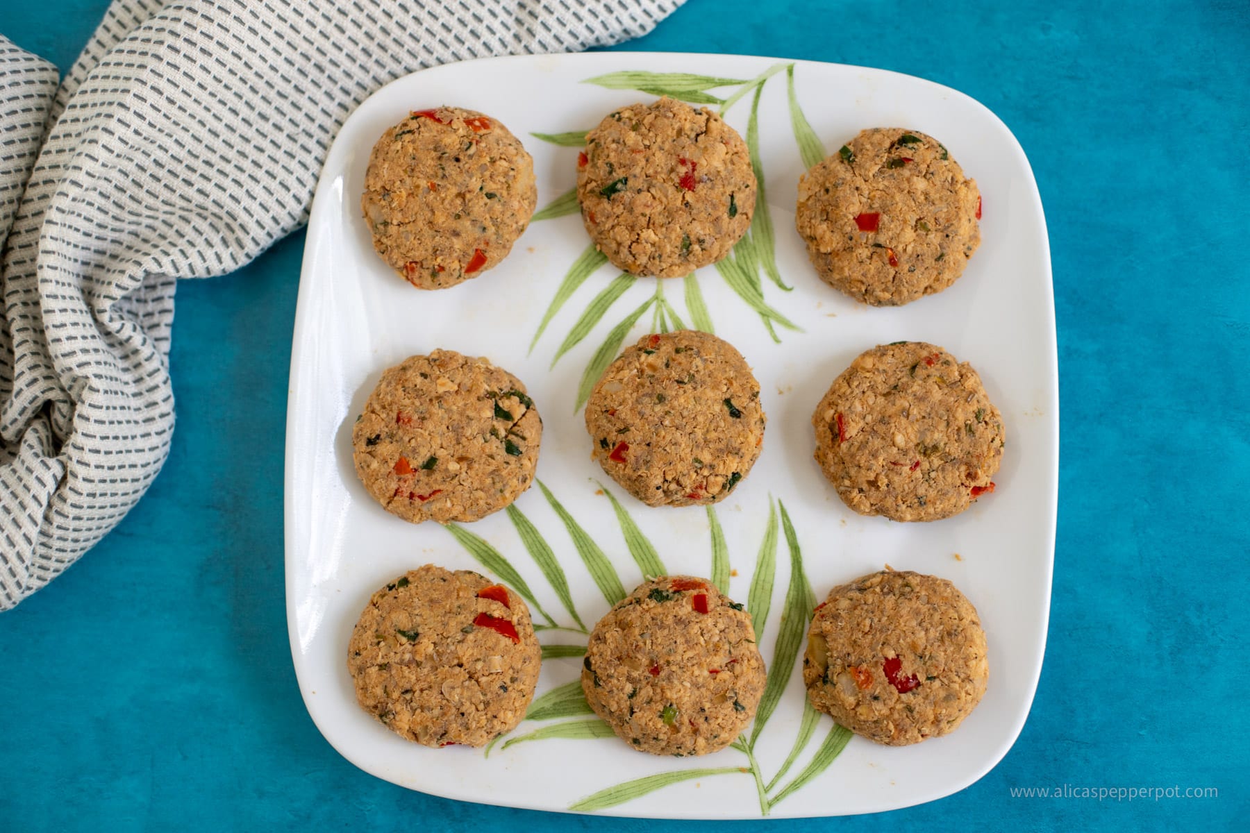 Salmon cakes shaped and in a plate.