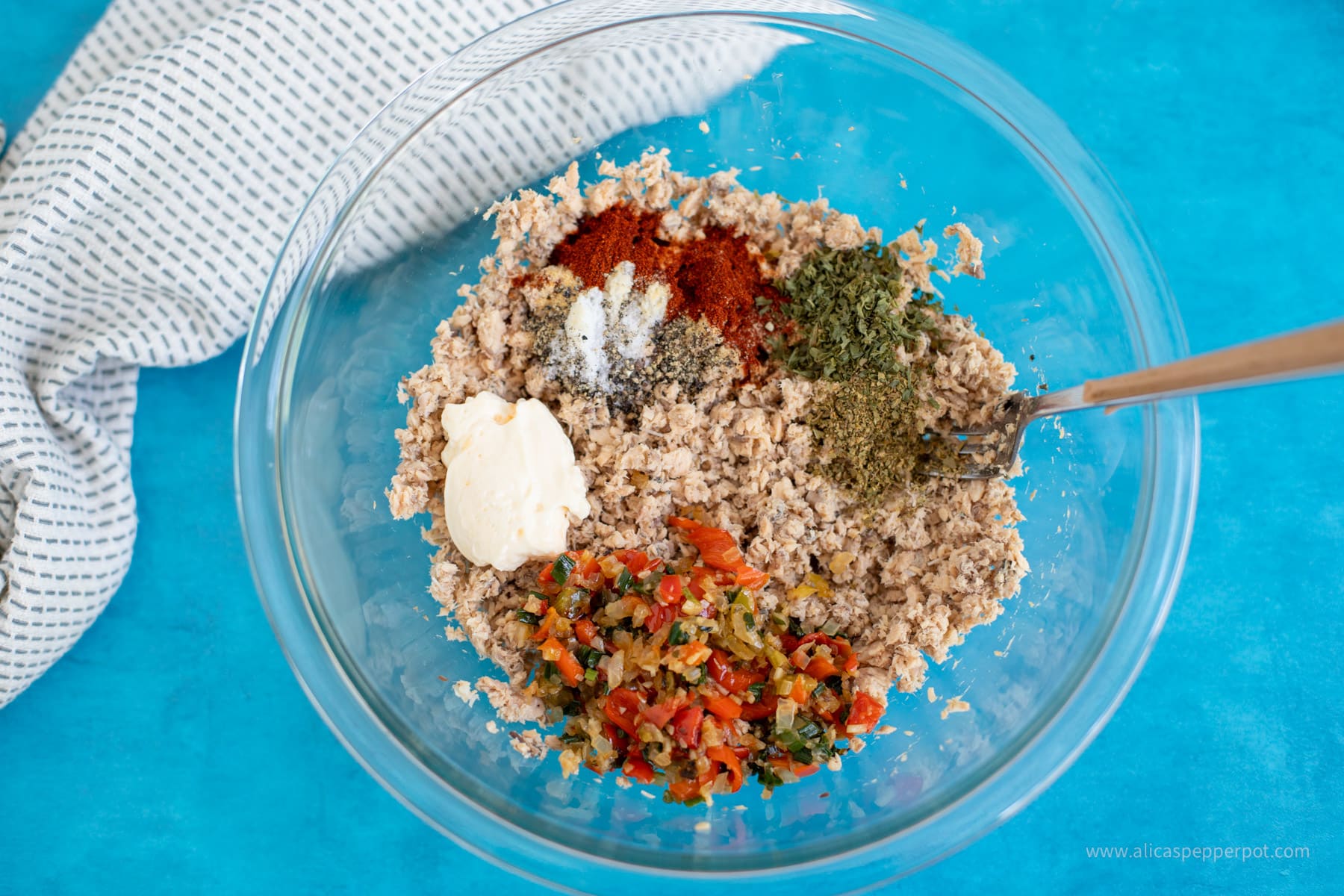 Mixing bowl with salmon and all ingredients.