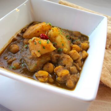 potato aka aloo and channa curry in white dish