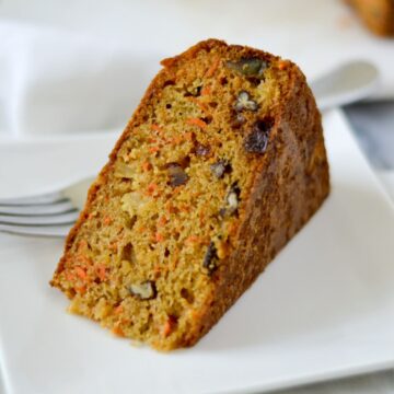 slice of carrot cake on a white plate