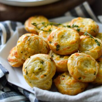 cheese pinwheels in a white serving plate